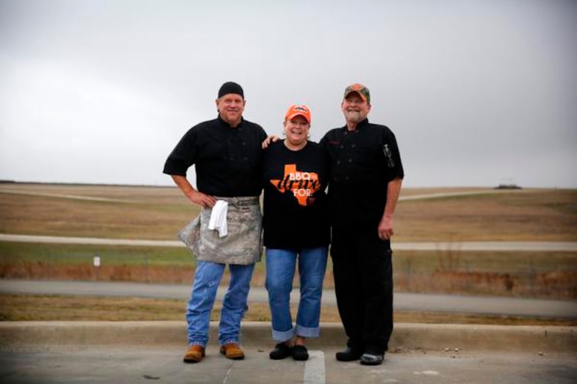 
BBQ on the Brazos pitmaster John Sanford, right, his wife Kathryn pose for a photo with...