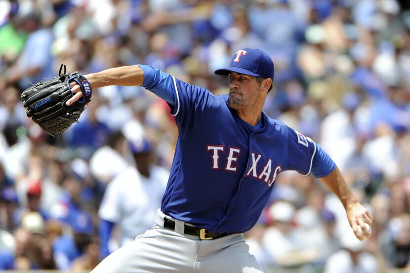 Texas Rangers starting pitcher Cole Hamels (35) throws against the Chicago Cubs during the...