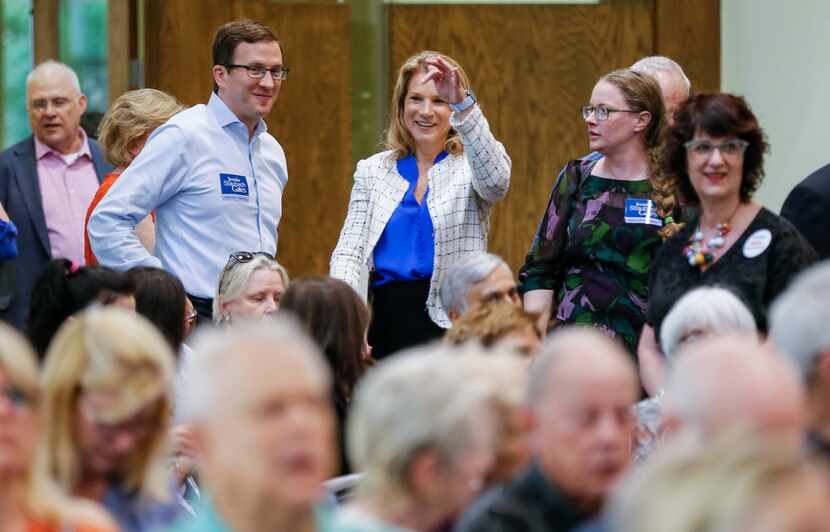 Jennifer Staubach Gates, center, councilwoman for City Council District 13, greets voters...