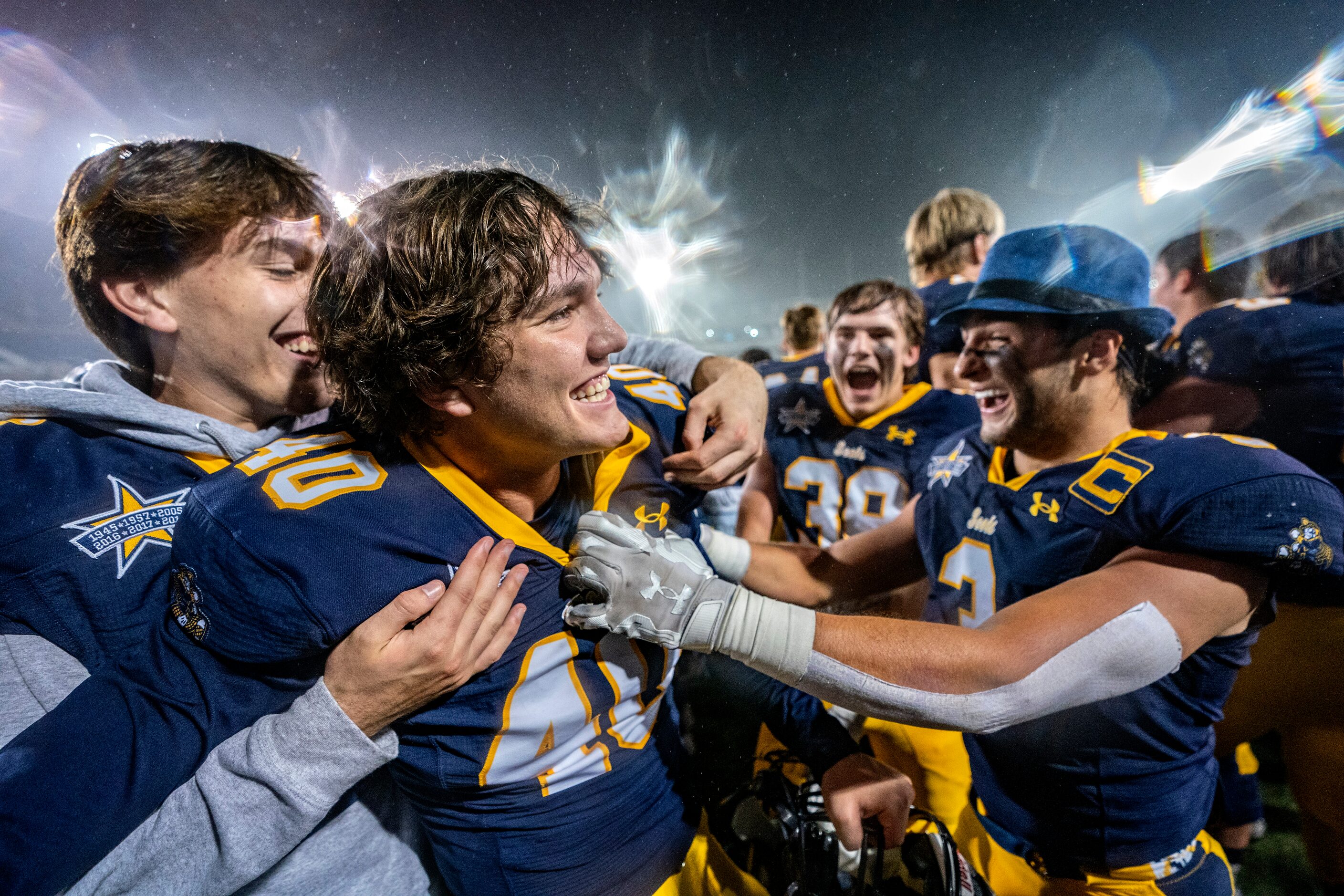 Highland Park senior kicker Nicholas Rigas (40) is congratulated by senior cornerback Hudson...