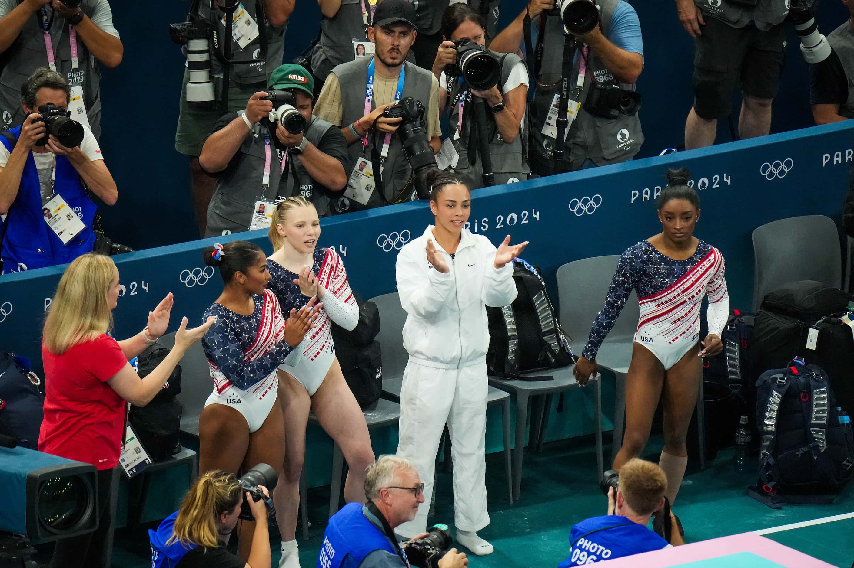 From left, coach Cecile Landi, Jordan Chiles, Jade Carey, Hezly Rivera and Simone Biles...
