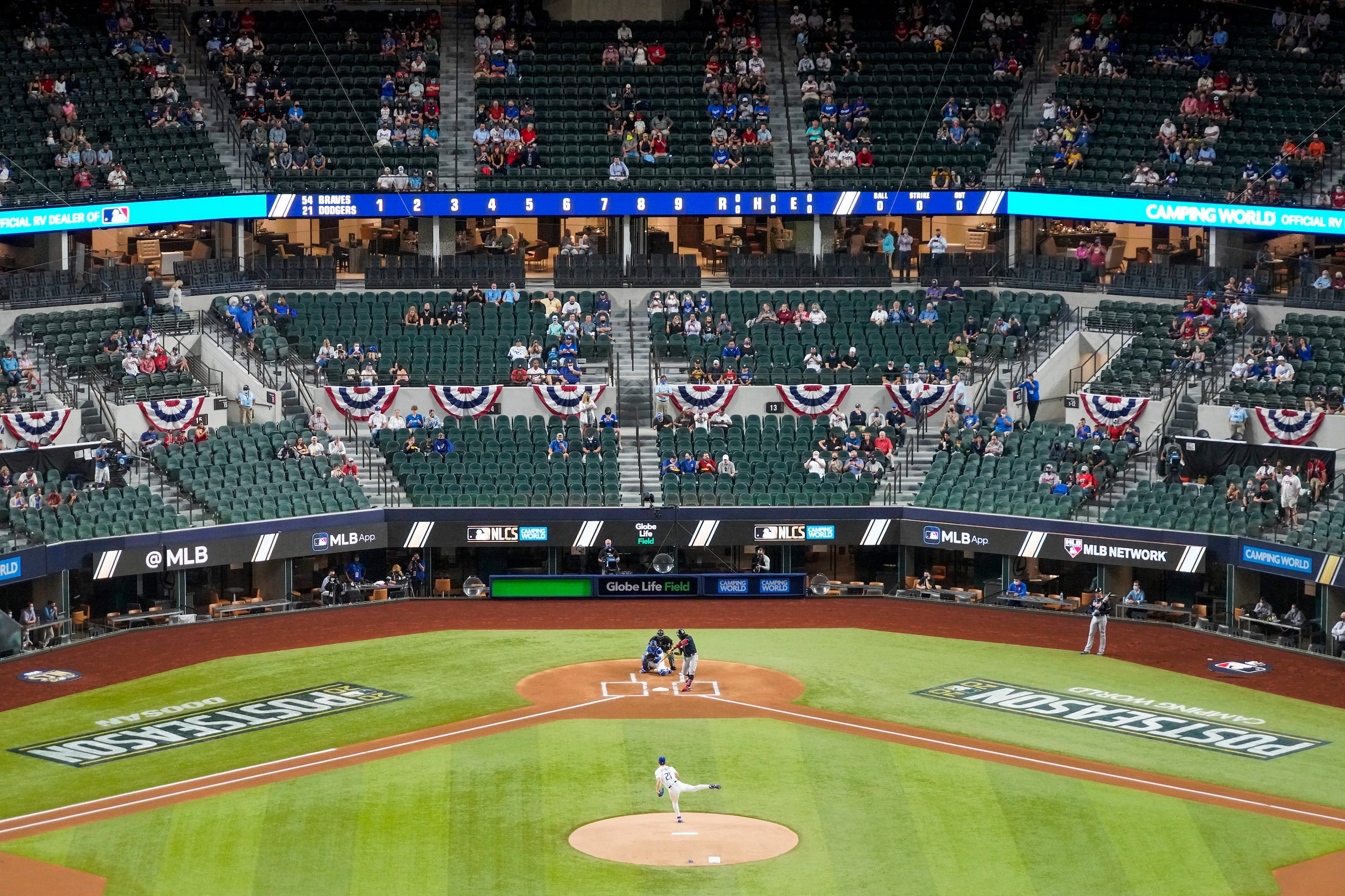 Los Angeles Dodgers starting pitcher Walker Buehler delivers the first pitch of the game to...