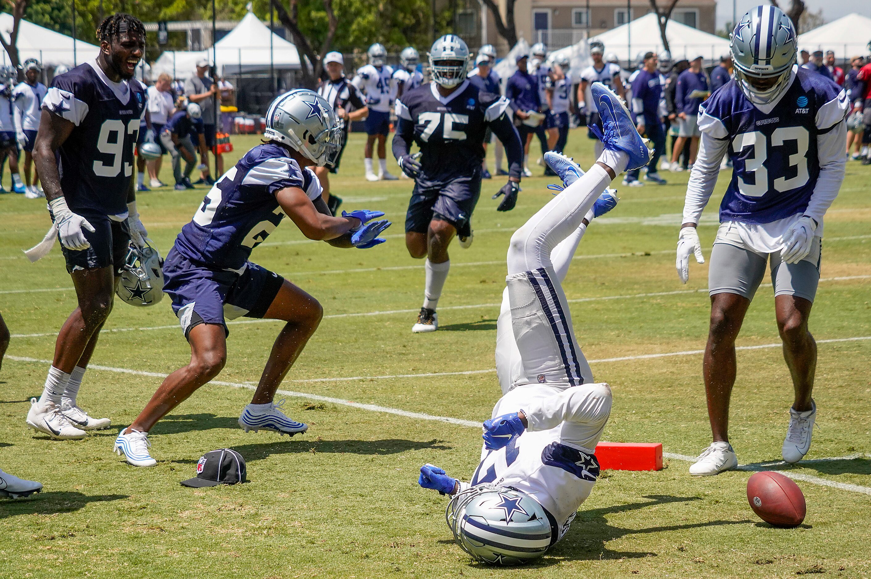 Dallas Cowboys wide receiver Malik Turner (17) takes a tumble as safety Steven Parker (25)...