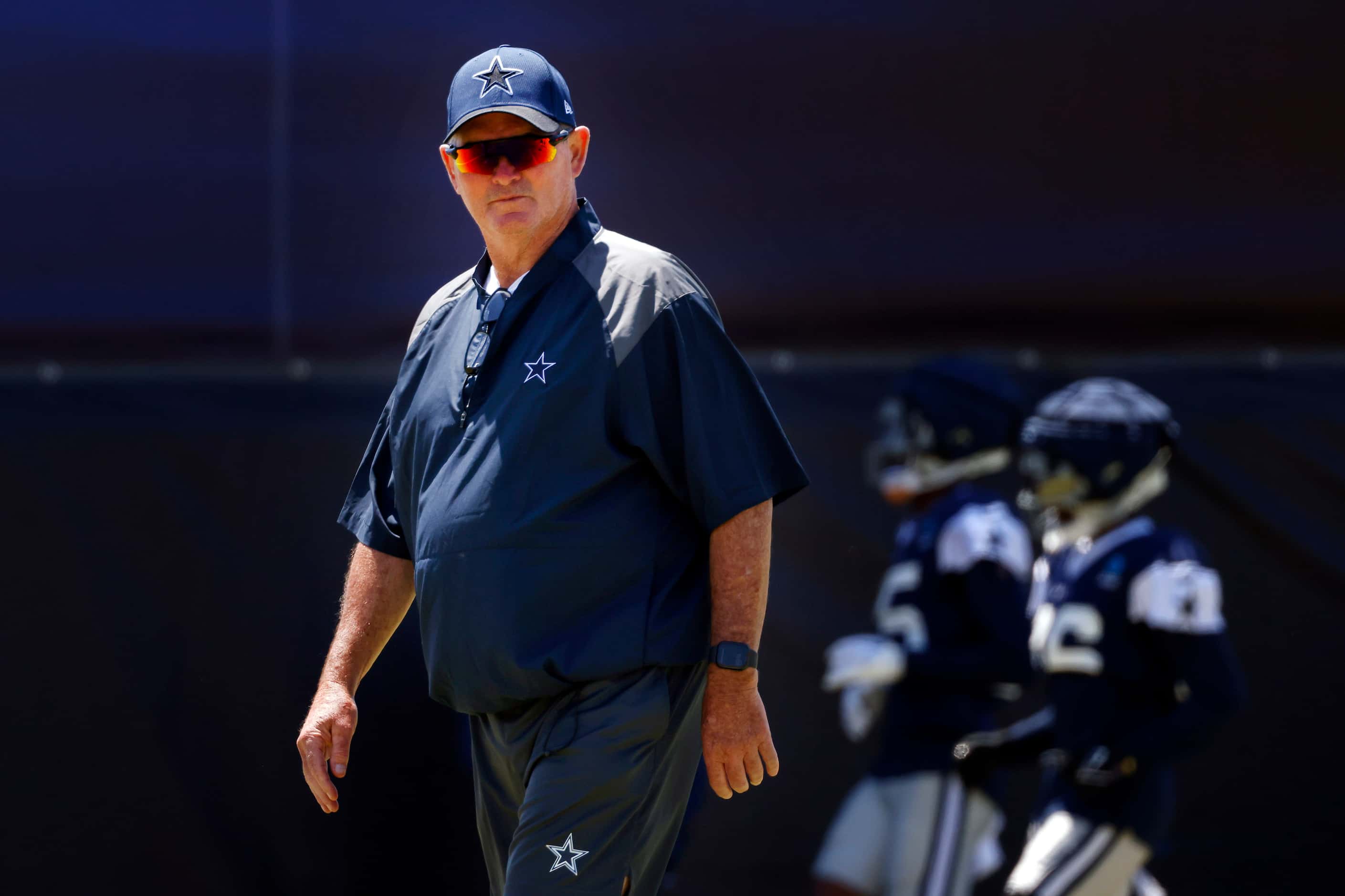 Dallas Cowboys defensive coordinator Mike Zimmer observes training camp practice in Oxnard,...