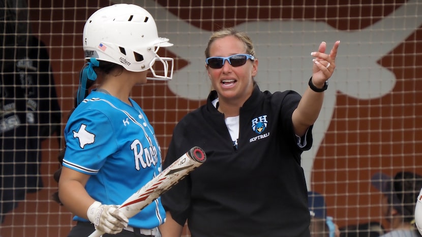 Prosper Rock Hill head coach Leigh Anne Budd (center) talks to batter Katerina Luna (left)...