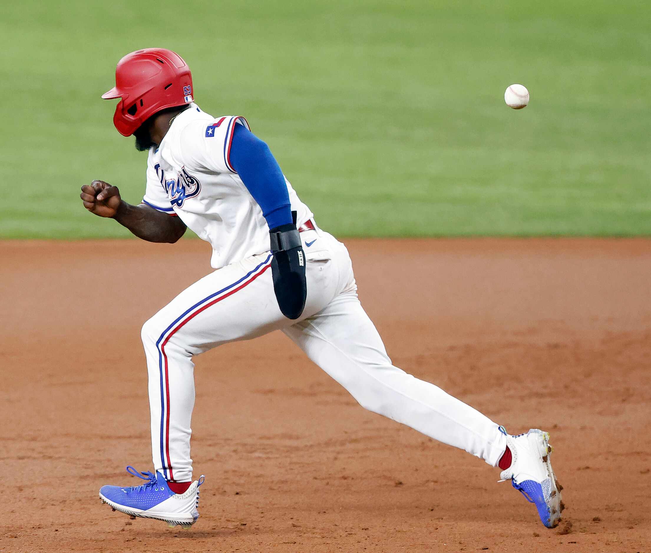 Texas Rangers center fielder Adolis Garcia (53) races to second on a hit ball by David Dahl...