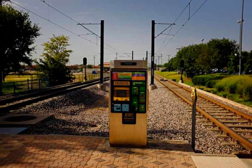 
A transit pass kiosk sits adjacent to the tracks at the DART Parker Road Station  in Plano.
