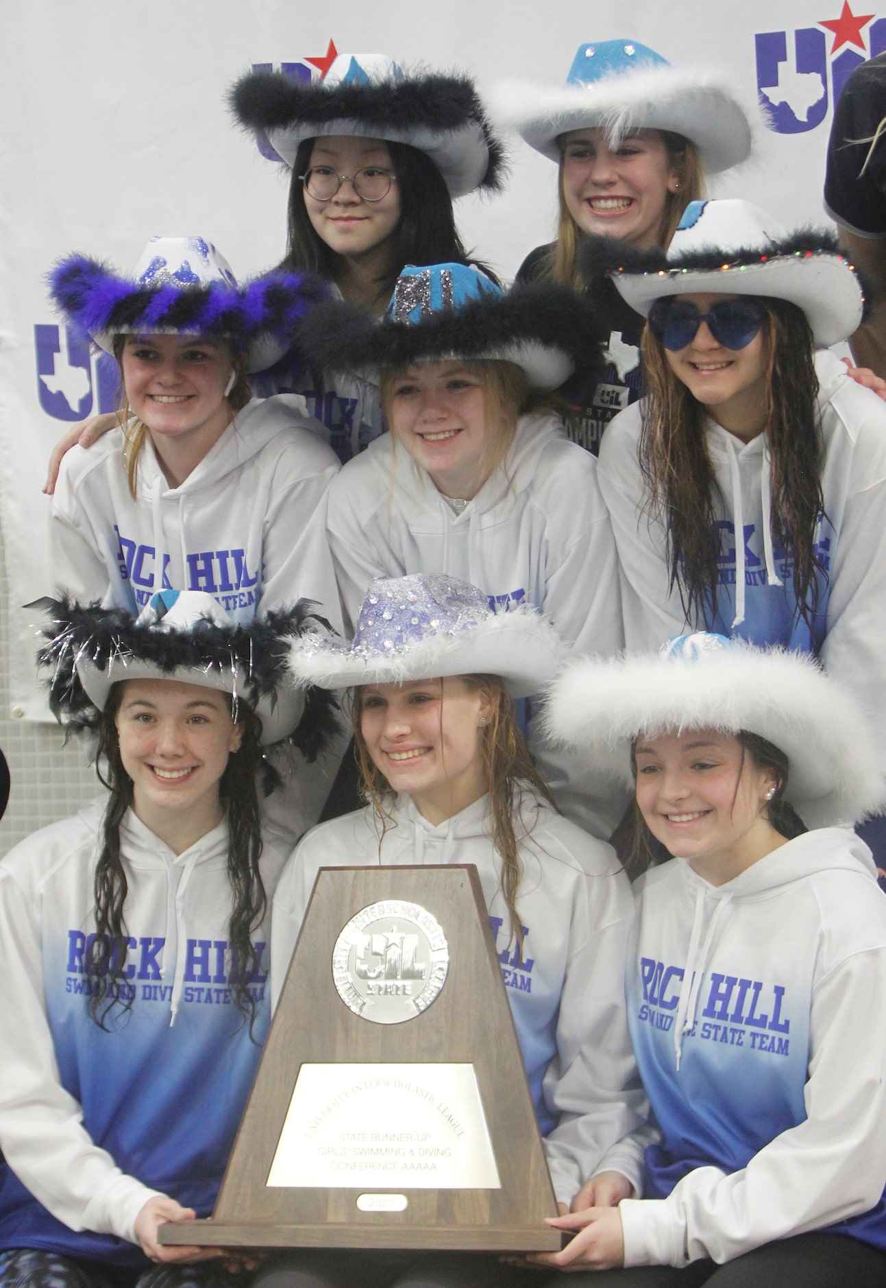 Prosper Rock Hill girls swim team members pose with their silver medal following 5A...