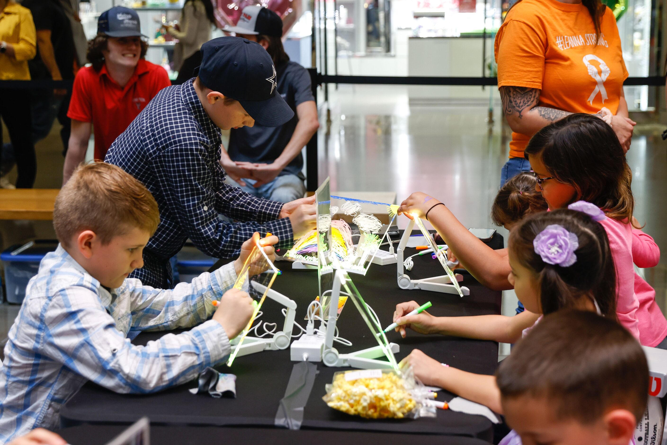 A group of kids participate in an activity at the NorthPark mall in Dallas on Thursday,...