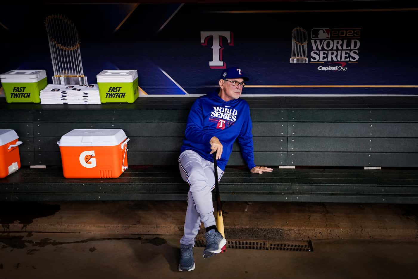Texas Rangers manager Bruce Bochy looks out from the dugout during a workout at Chase Field...