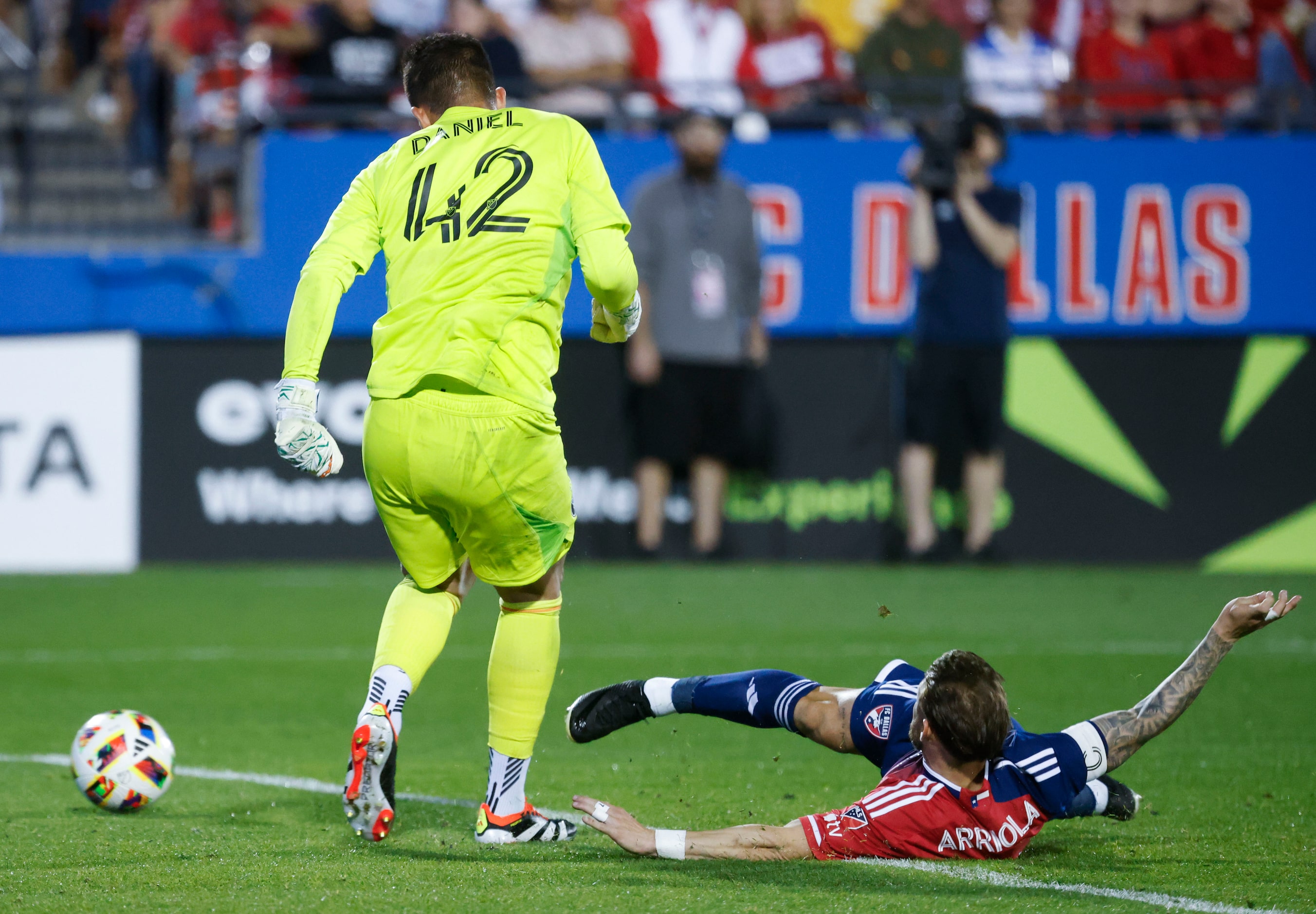 FC Dallas forward Paul Arriola (right) intercepts the ball against San Jose goalkeeper...