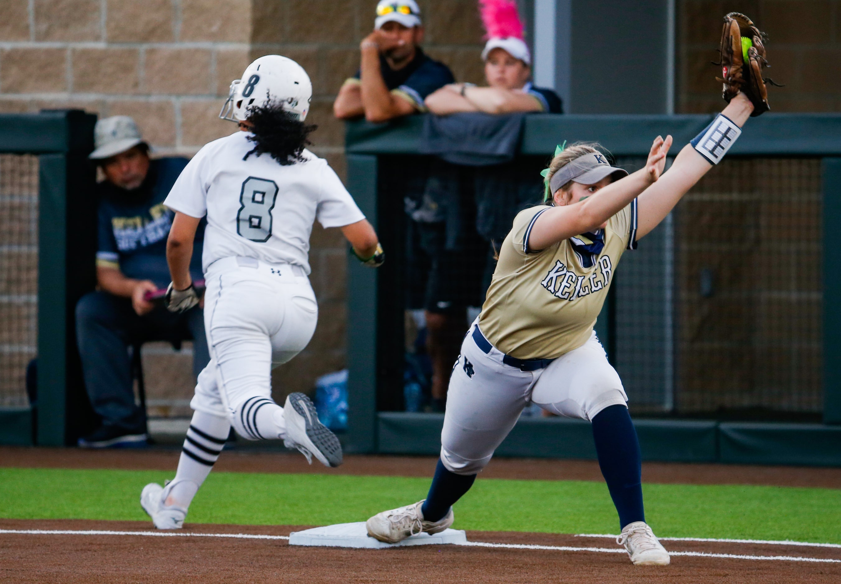 Denton Guyer's Tehya Pitts (8) is out at first base by Keller's Bella Smith (20) during the...