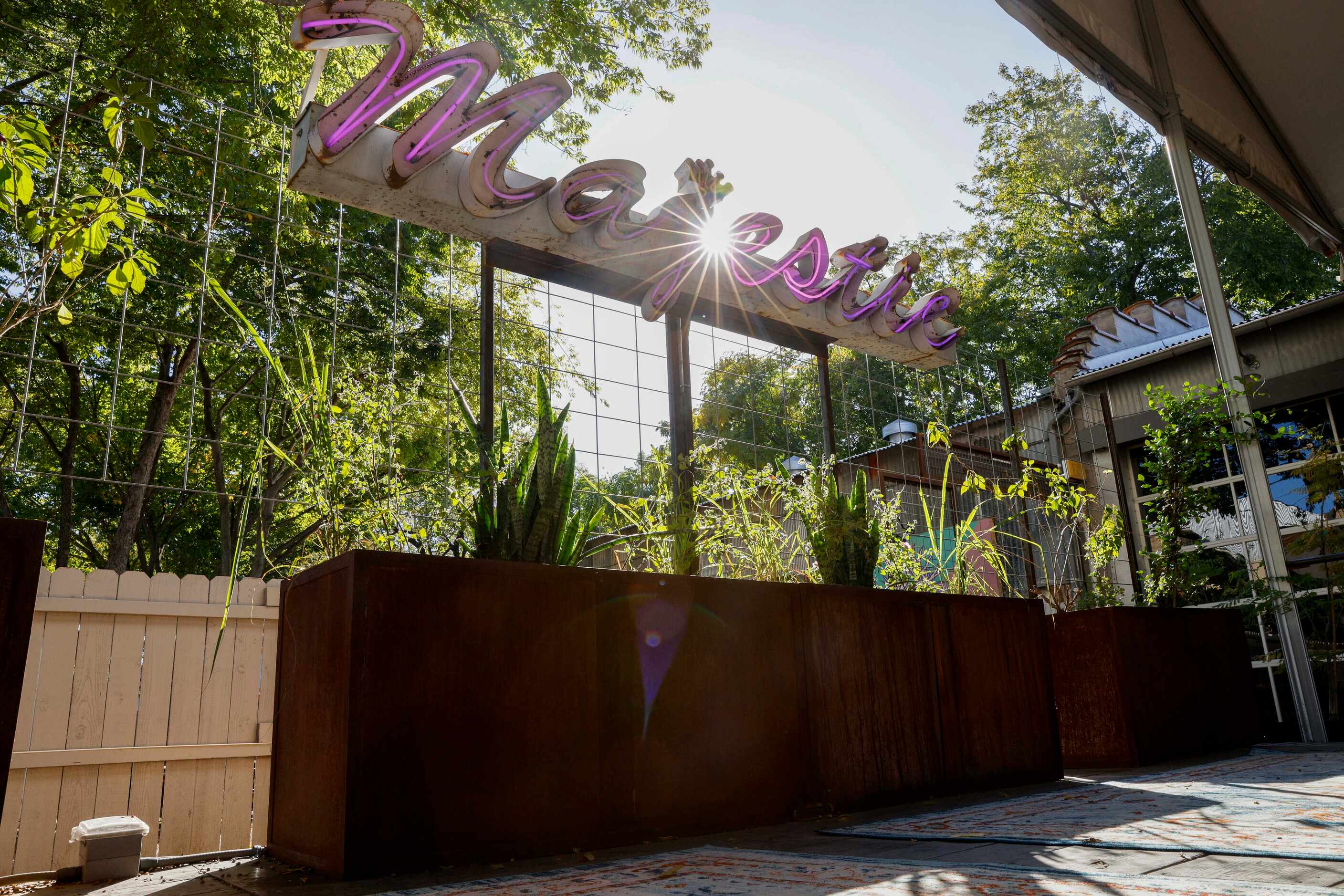 The sun shines through a Majestic sign outside at Henrys Majestic, Monday, Nov. 6, 2023, in...