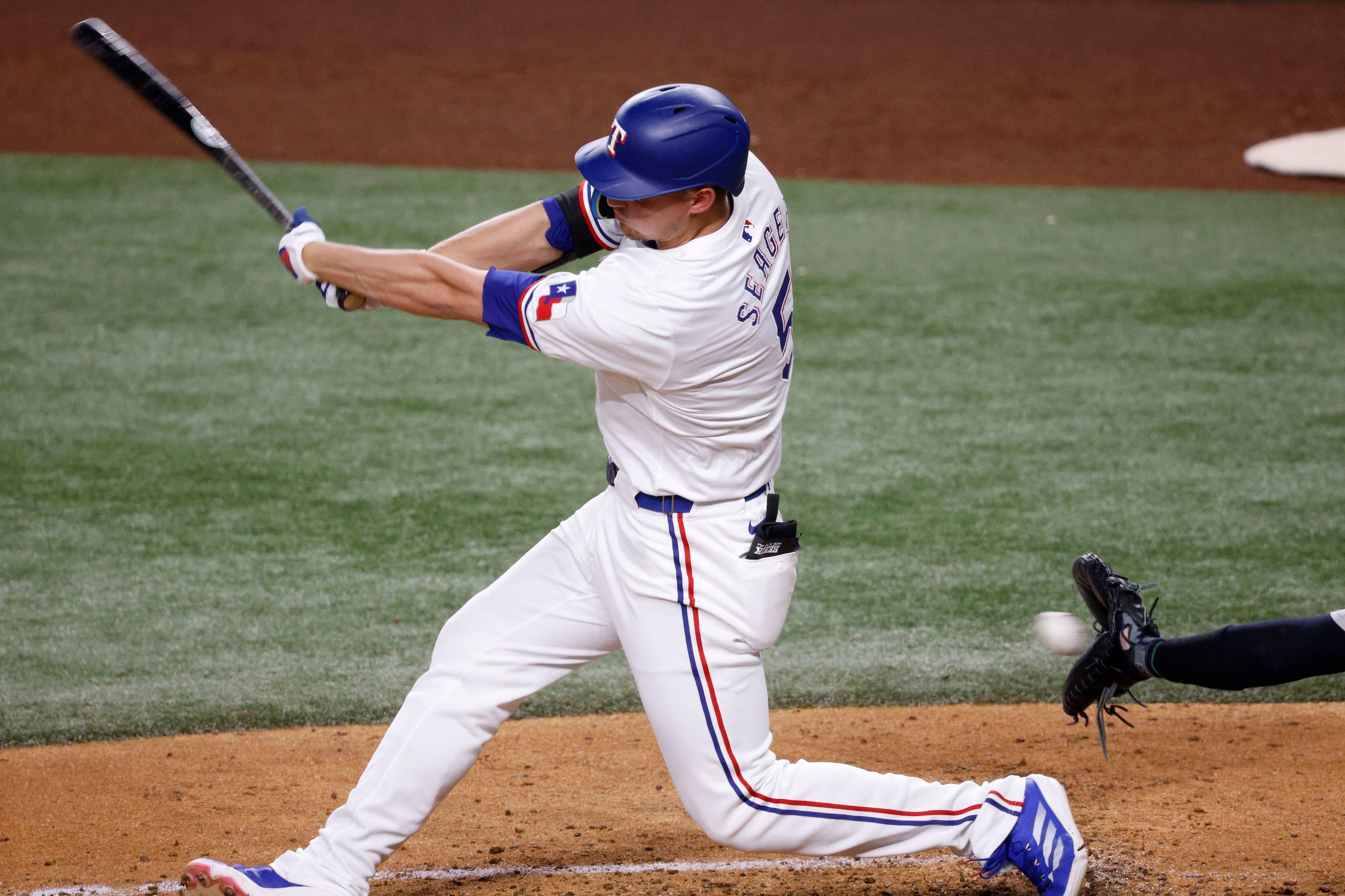 Texas Rangers designated hitter  Corey Seager (5) swings during the fifth inning of a...