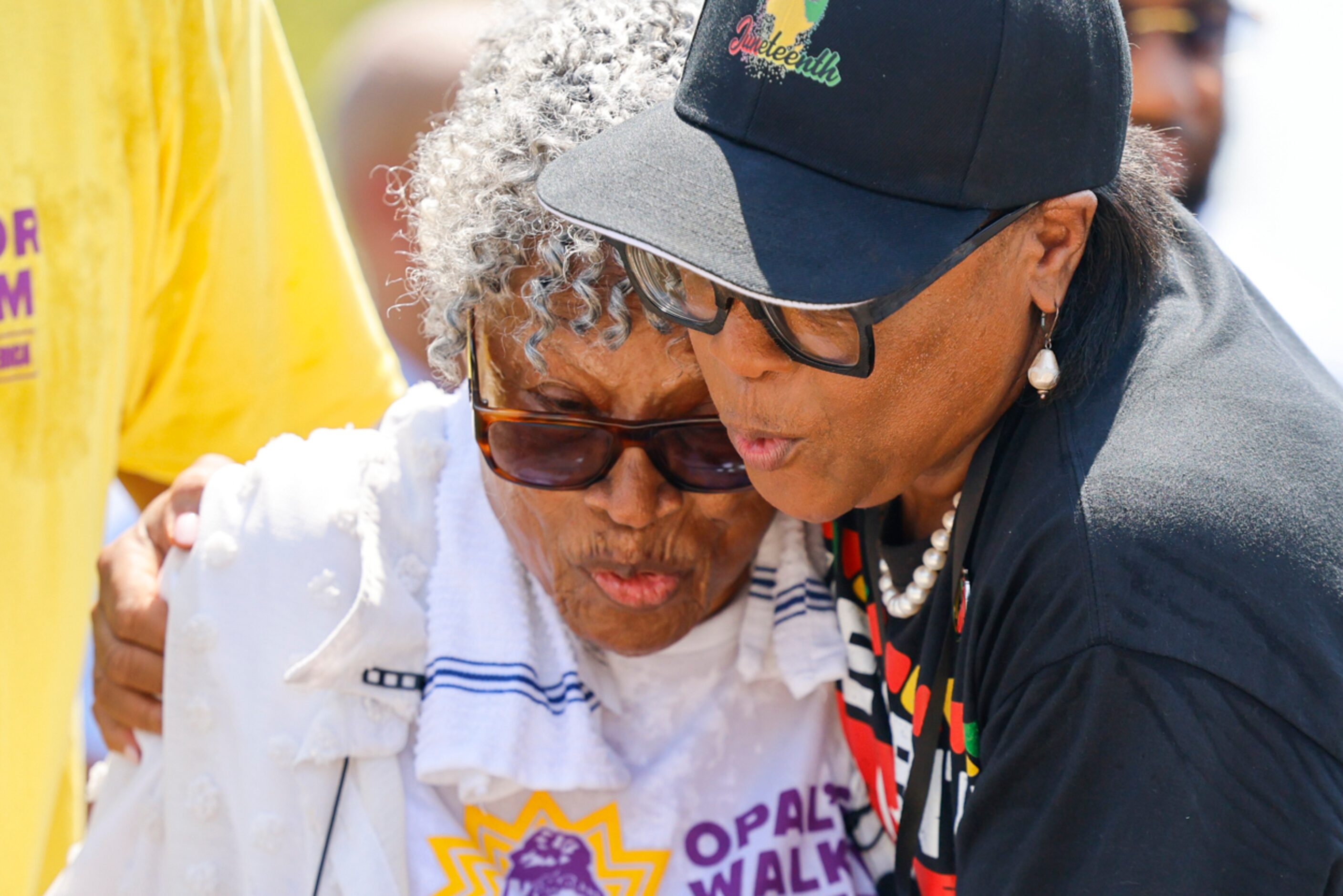 Grandmother of Juneteenth, Opal Lee (left), hugs Chief Executive Officer of Dallas...