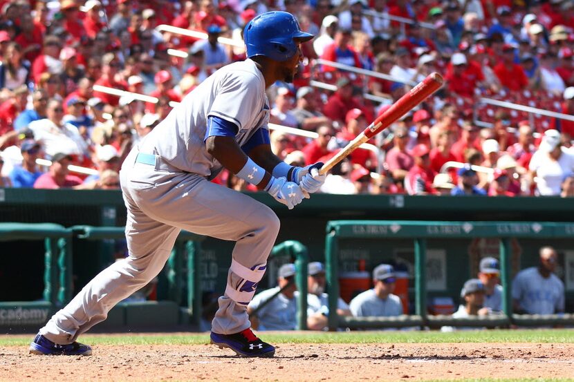 ST. LOUIS, MO - JUNE 19: Elvis Andrus #1 of the Texas Rangers drives in the game winning run...