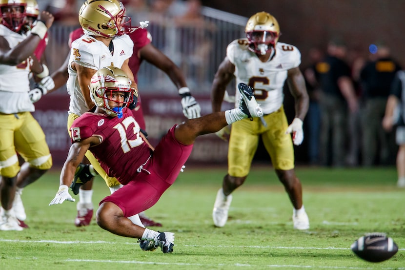 Florida State running back Jaylin Lucas (13) watches as a pass intended for him bounces away...