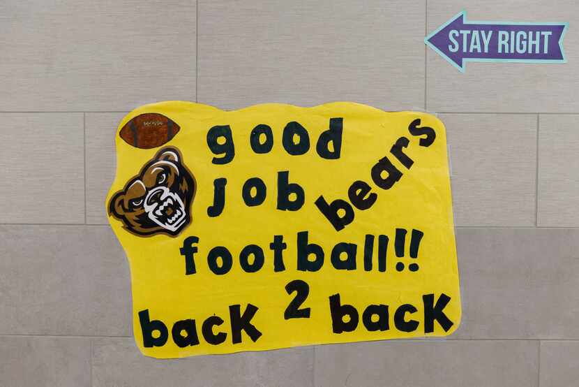 A sign supporting the football team on making it to the state championship two years in a...