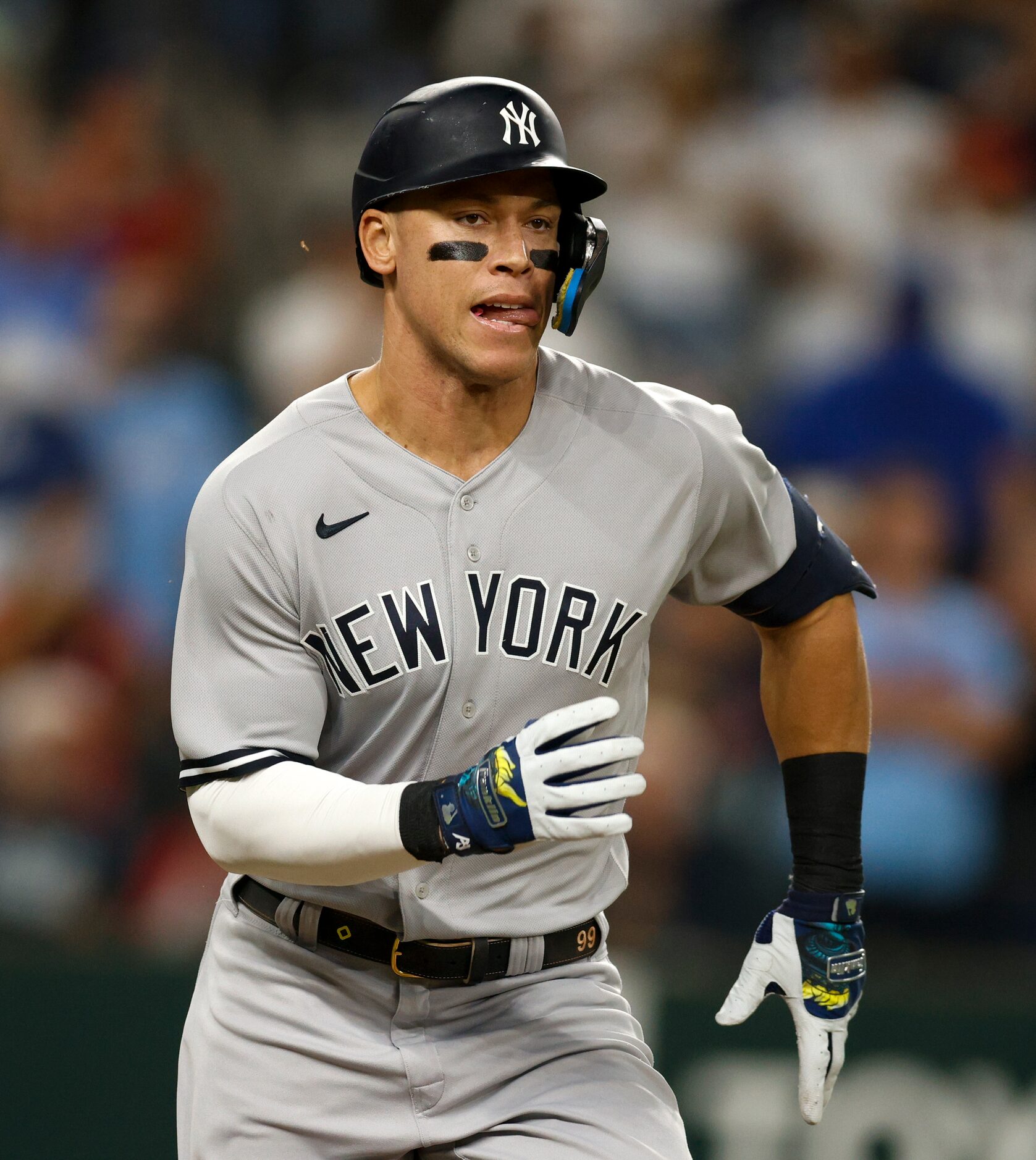 New York Yankees right fielder Aaron Judge (99) runs to first base after a hit during the...