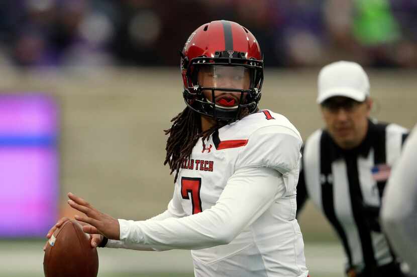 Texas Tech quarterback Jett Duffey (7) looks for a receiver during the first half of an NCAA...