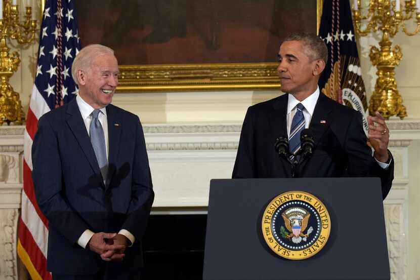 President Barack Obama, right, honors Vice President Joe Biden, left, during a ceremony in...