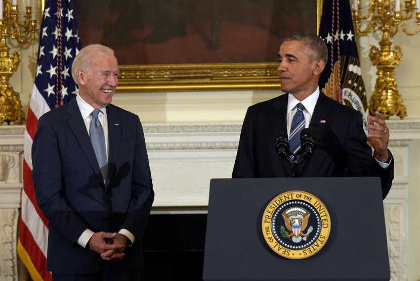 President Barack Obama, right, honors Vice President Joe Biden, left, during a ceremony in...