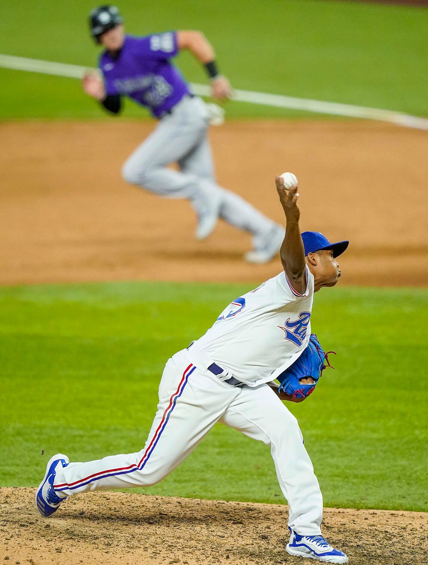 Texas Rangers pitcher Jose Leclerc pitches during the ninth inning on opening day against...