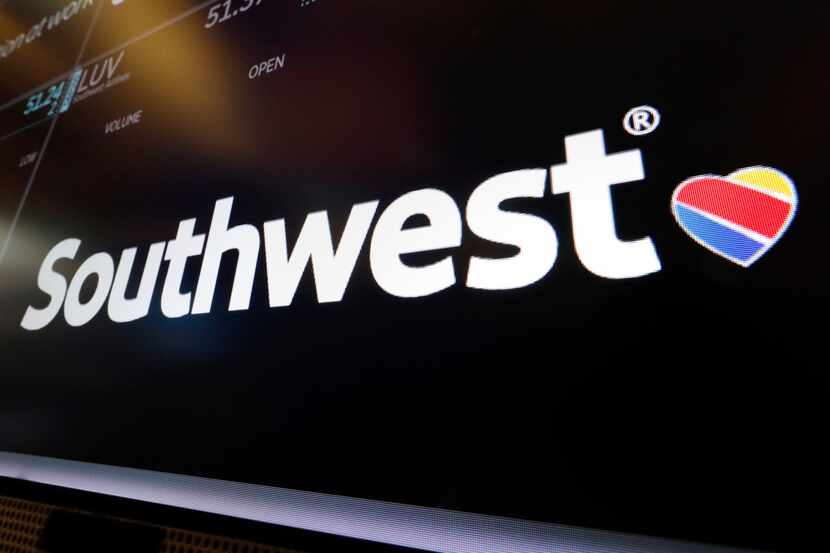 The logo for Southwest Airlines appears above a trading post on the floor of the New York...