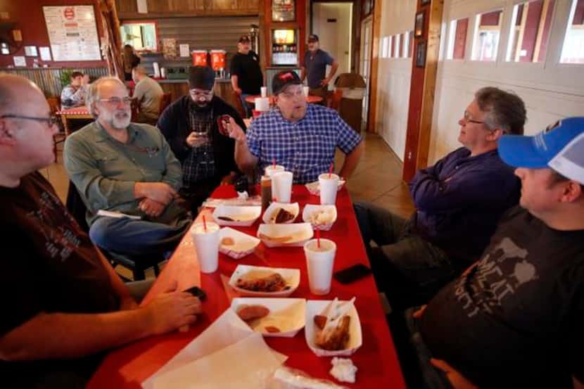 
Texas BBQ Posse members (from left) Jim Rossman, Gary Jacobson, Daniel Goncalves, Chris...