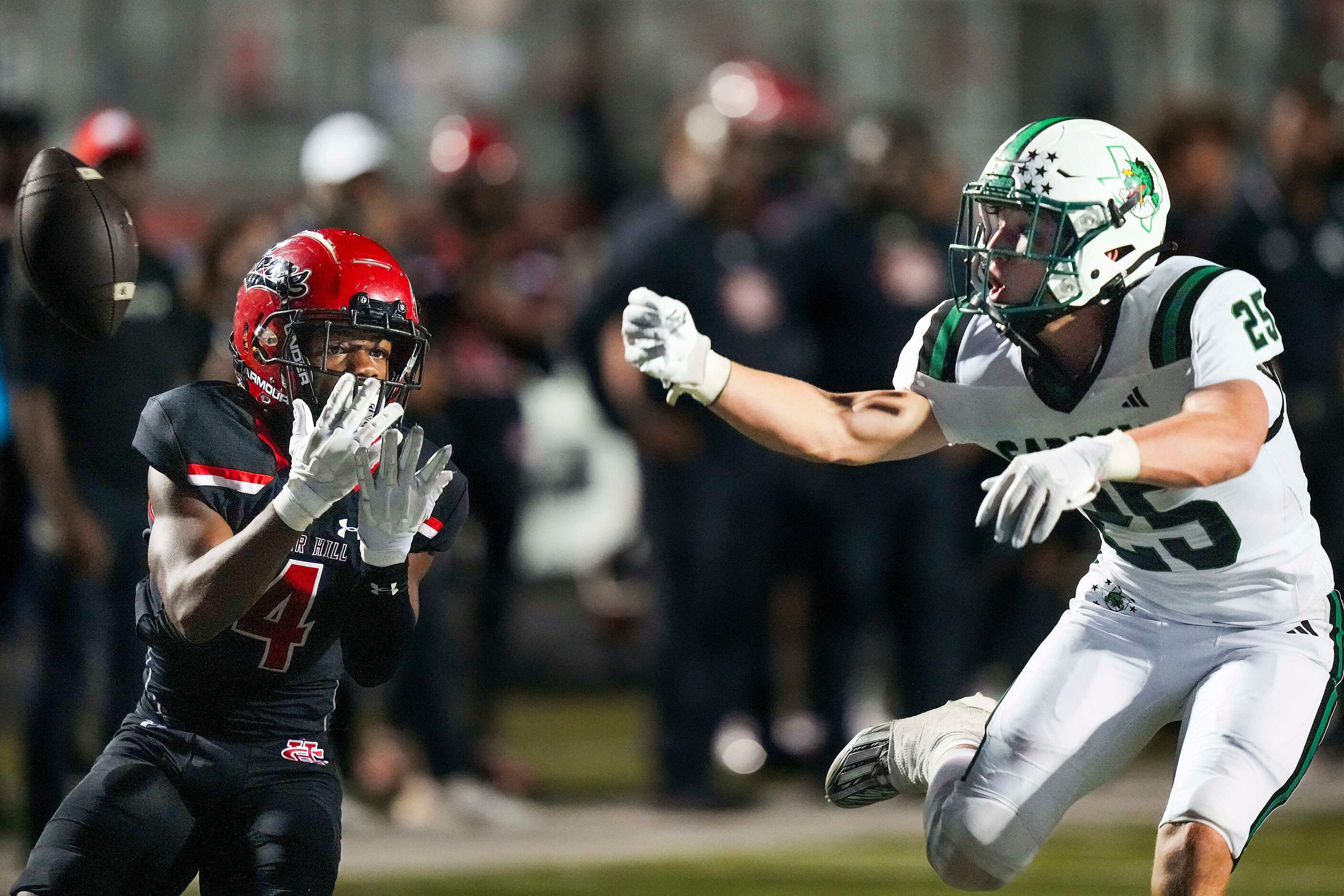 Southlake Carroll defensive back Sam Fuller (25) breaks up a pass intended for Cedar Hill...