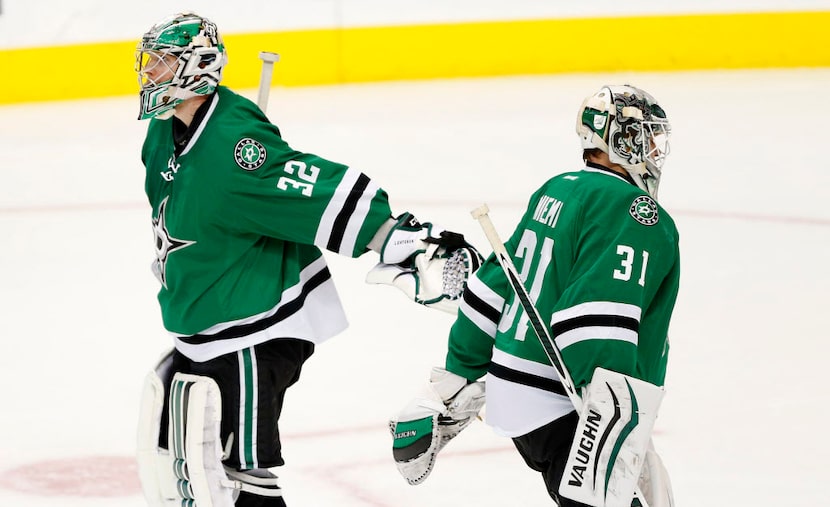 Dallas Stars goalie Antti Niemi (31) replaces starting goalie Kari Lehtonen (32) in the...