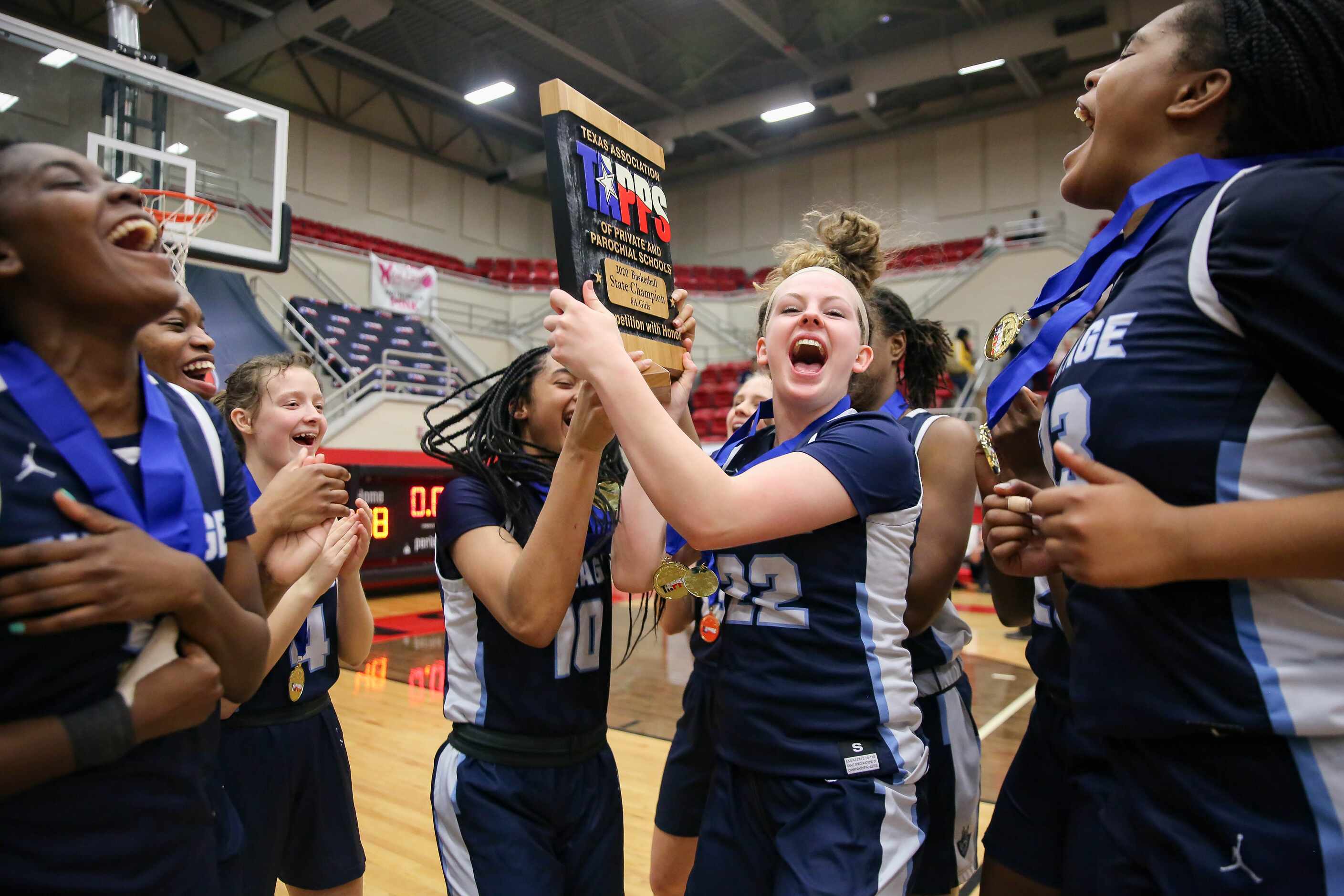 Players from the Village School celebrate after beating Plano Prestonwood Christian during a...