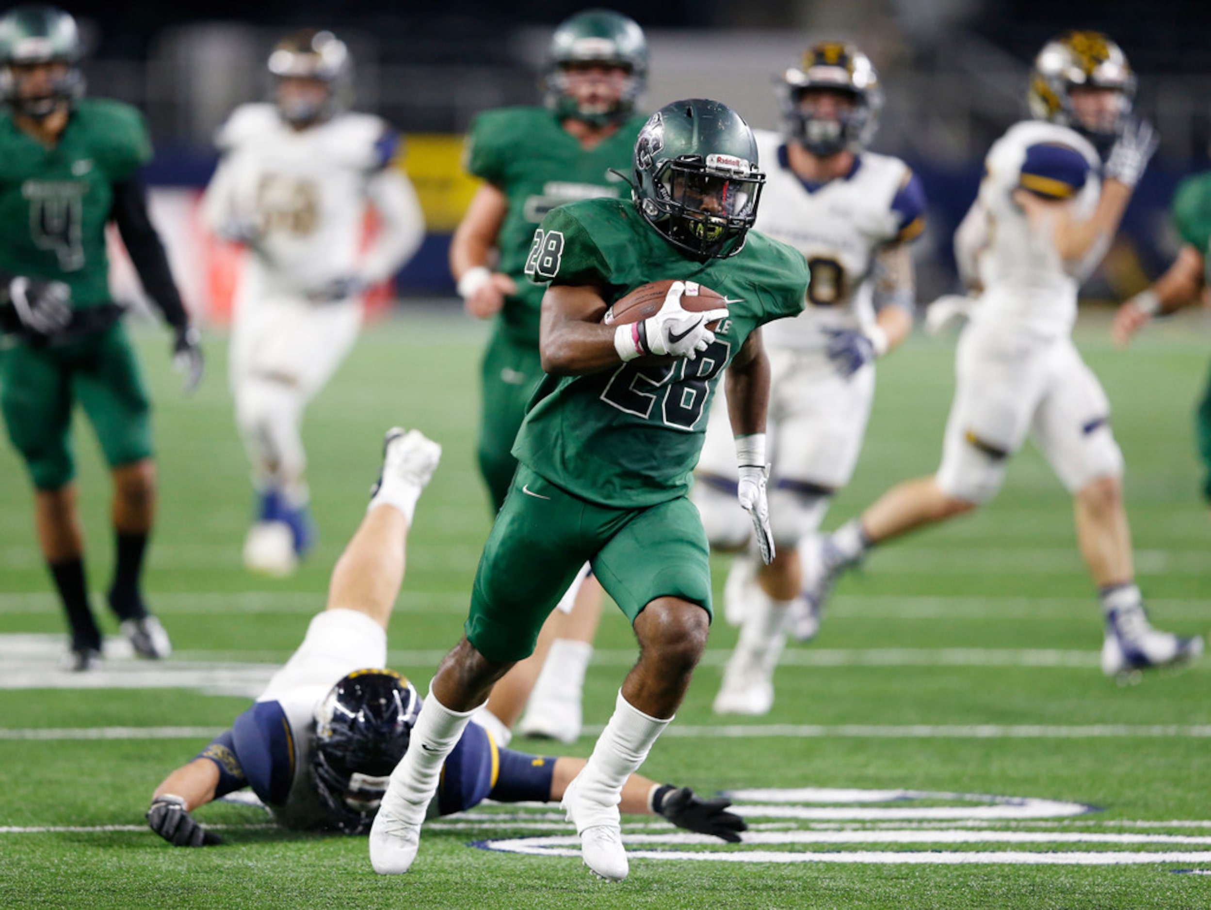 Kennedale's DJ Kirven (28) on his way to the end zone to score a touchdown in a game against...