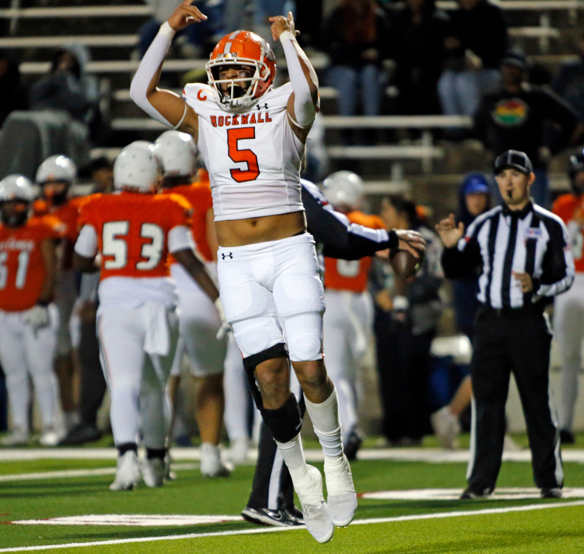 Rockwall High Edwin Gonzales-Salas (5) celebrates after recovering a Sachse High fumble...