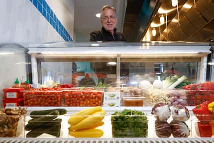 Customers order here, in front of a case that shows which vegetables are used in the...