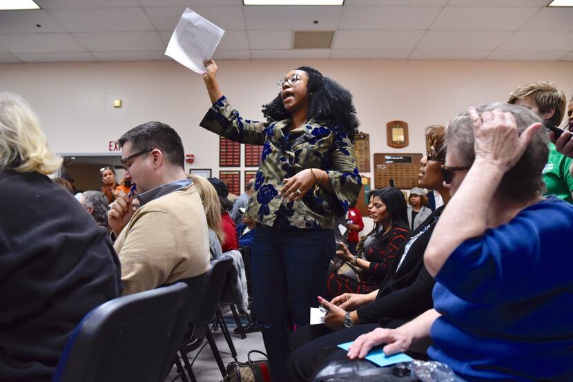Judge Amber Givens-Davis of the 282nd Judicial District Court, stands to ask a question...
