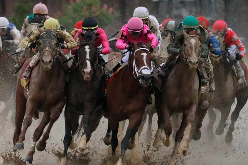 Flavien Prat on Country House, left, races against Luis Saez on Maximum Security, third from...