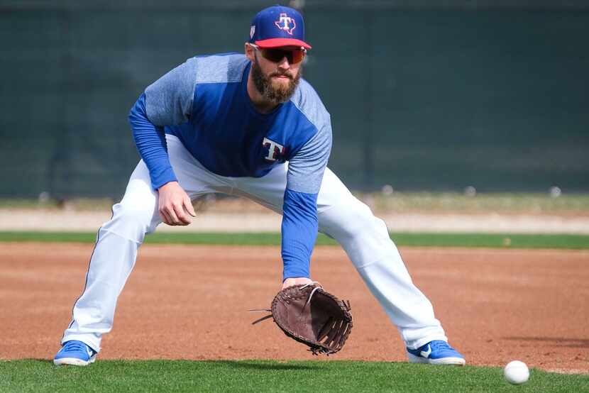 Texas Rangers infielder Matt Davidson participates in a fielding drill during the first full...