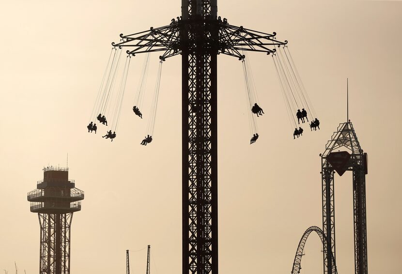 Six Flags Over Texas visitors ride the Texas SkyScreamer, the worlds tallest swing carousel...