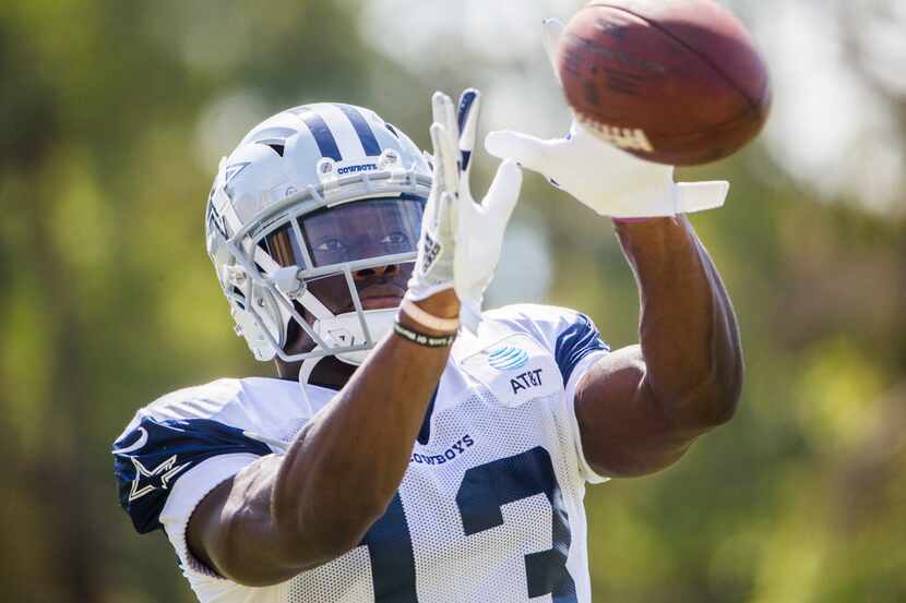 Dallas Cowboys wide receiver Michael Gallup (13) catches a pass during an afternoon practice...