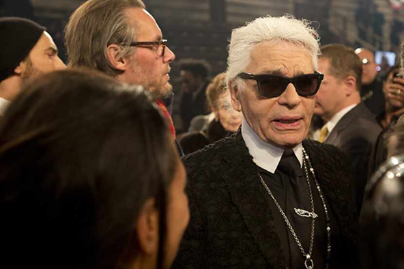 Karl Lagerfeld is interviewed after the Chanel "Metiers d'Art" Show at Fair Park on Dec. 10,...