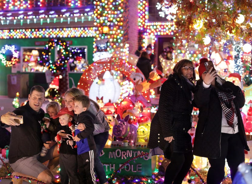 The Thursday night before Christmas, the Burkman holiday display was filled with visitors,...