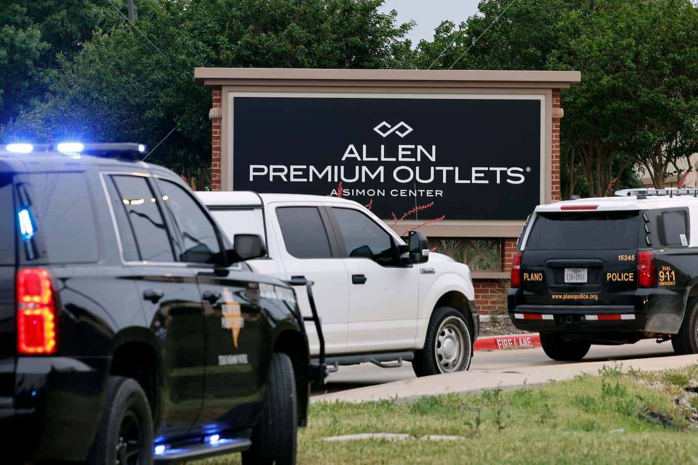 Law enforcement responds to the scene after a mass shooting at the Allen Premium Outlets in...