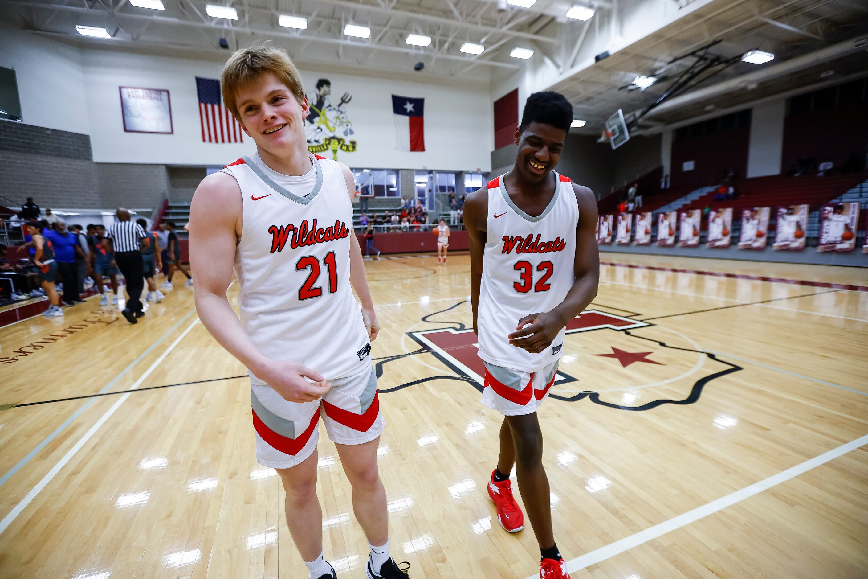 Lake Highlands senior guard Ethan Davis (21) and senior forward Issaiah Tate (32) celebrate...