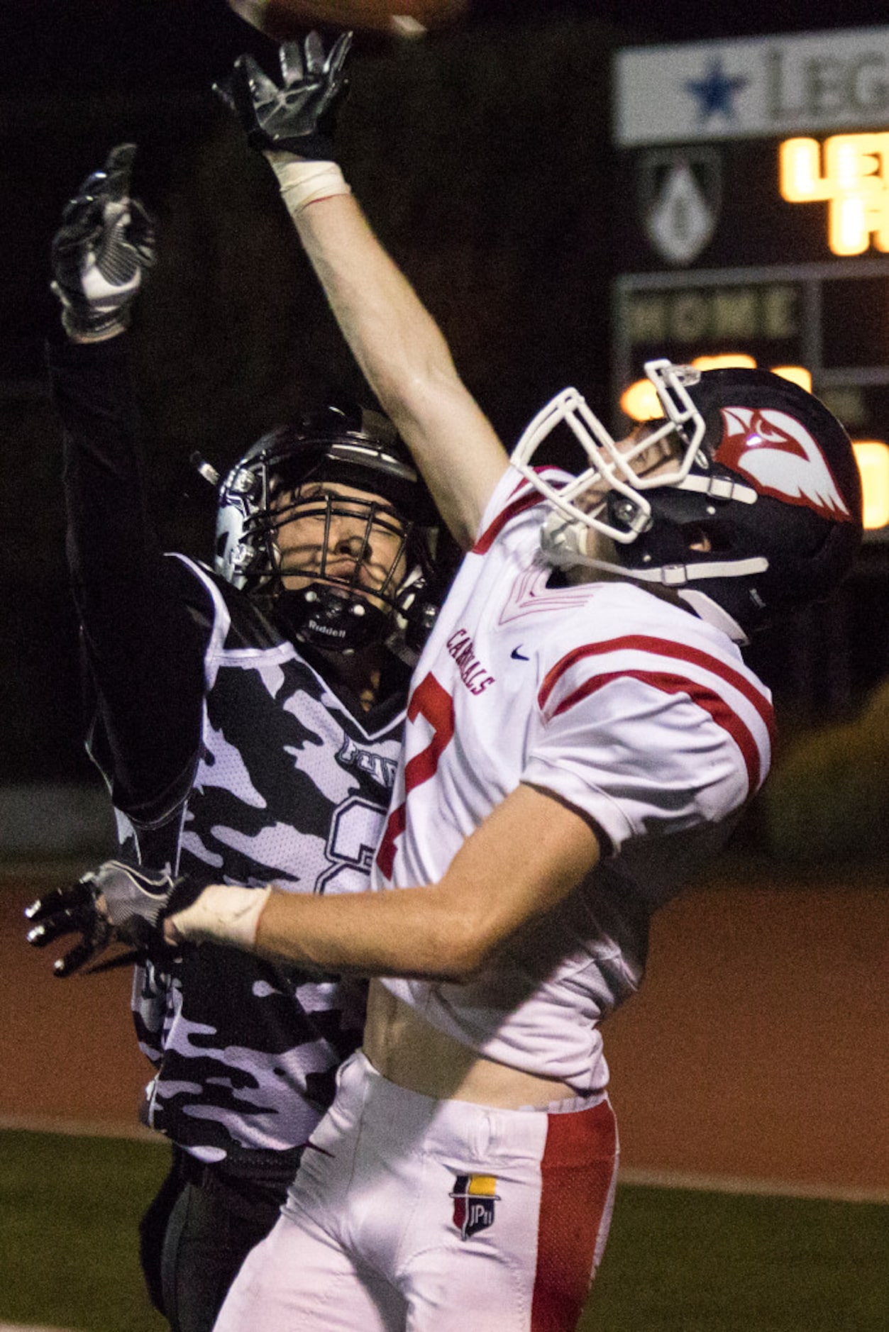 Bishop Lynch defensive back Benn Cole (2) attempts to break up a pass intended for John Paul...