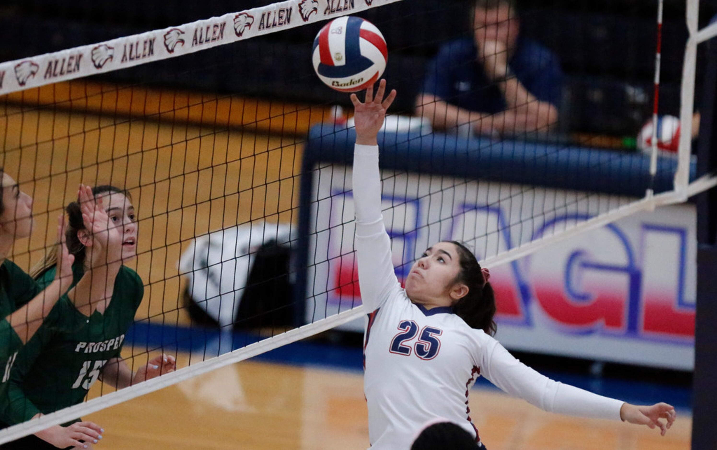 Allen High School setter Emma Vu (25) tips the ball over the net during game two as Allen...