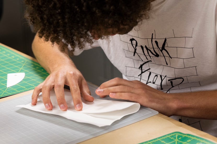 Travis Nolan, an SMU paleontology student who makes origami dinosaurs to visualize what...