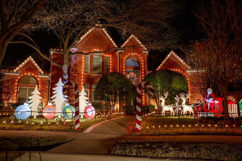Holiday lights and decorations adorn houses in the Deerfield neighborhood in Plano.