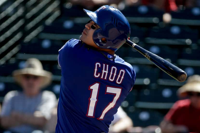 Texas Rangers' Shin-Soo Choo bats during a spring training baseball exhibition game against...