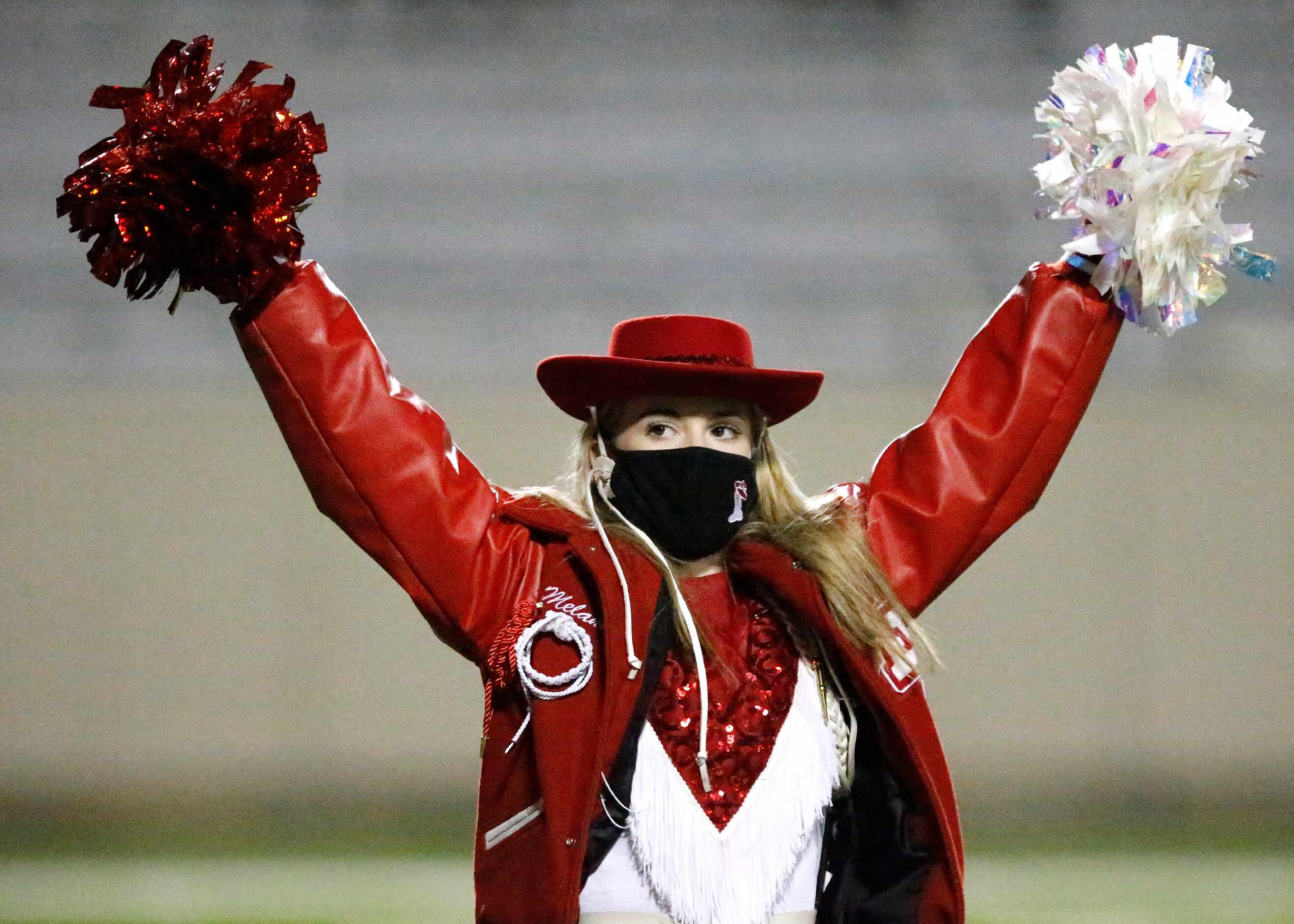 Melanie Hooper performs with the Lake Highlands Highlandettes before kickoff as Lake...